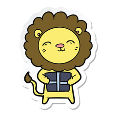 sticker of a cartoon lion with christmas present