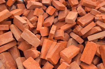 Group of bricks square construction materials. Conceptual image of red bricks pile. bricks at a construction site