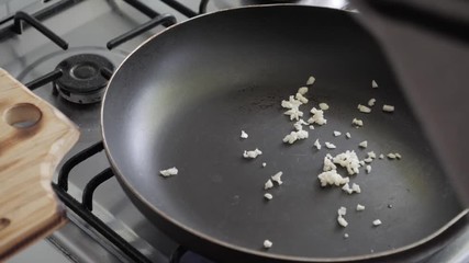 Cooking at home with casserole, garlic and olive oil