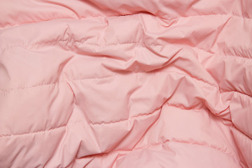 Textile and texture concept. Close up of pink fabric background