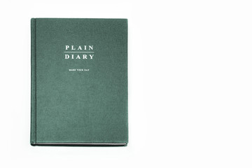 green daily planner on white background