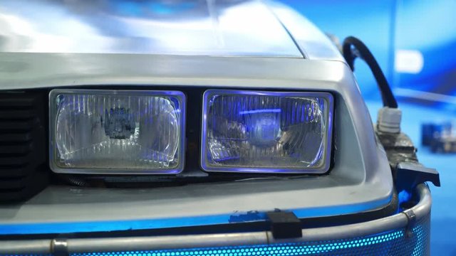 Headlight of retro gray sports car from movie