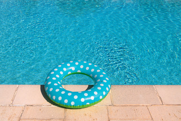 Fototapeta na wymiar Pool with inflatable blue ring