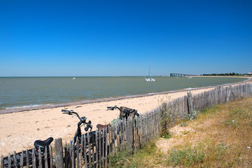 Bikes at the beach and bridge to mainland Ile the Re