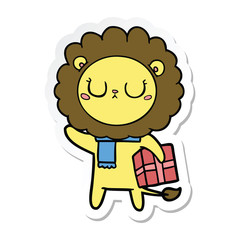 sticker of a cartoon lion with christmas present