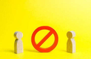 Two figures of persons are separated by a large red NO symbol or a prohibition sign. Concept of...