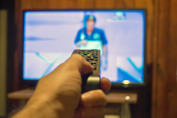 Watching TV and using remote controller