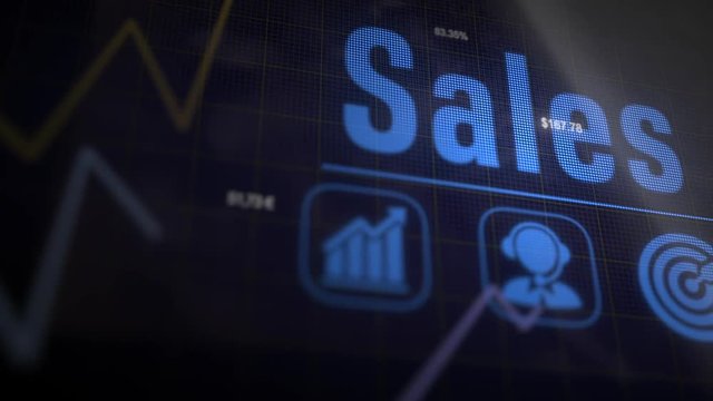 Sales business concept on a flashing computer monitor with moving graphs and data.
