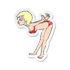 retro distressed sticker of a cartoon pin up girl in bikini