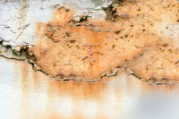 Heavily rusted metal surface yellow in color