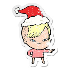 cute distressed sticker cartoon of a girl with hipster haircut wearing santa hat