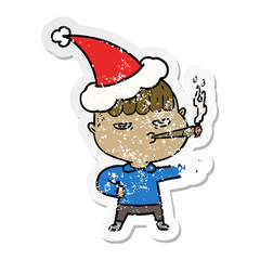 distressed sticker cartoon of a man smoking wearing santa hat