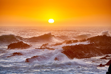 High waves at beautiful sunset