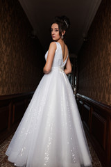 Fototapeta premium Young beautiful bride in antique interior