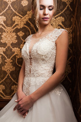 Fototapeta premium Morning of the bride when she wears a beautiful dress, woman getting ready before wedding ceremony 