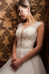 Fototapeta premium Morning of the bride when she wears a beautiful dress, woman getting ready before wedding ceremony 