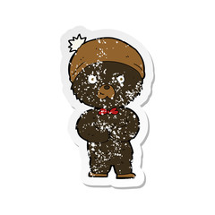 retro distressed sticker of a cartoon little black bear
