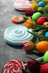 candies with jelly and sugar with tulips and easter eggs.