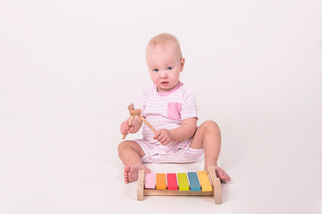 kid with a xelophon on a white background