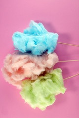 Obraz premium colorful cotton candy floss. sweet party food in pink and green