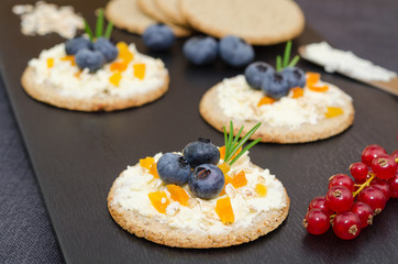  Finger food: cream cheese cracker. Cracker and cheese hors d'oeuvres. Blueberry cream cheese appetizer 