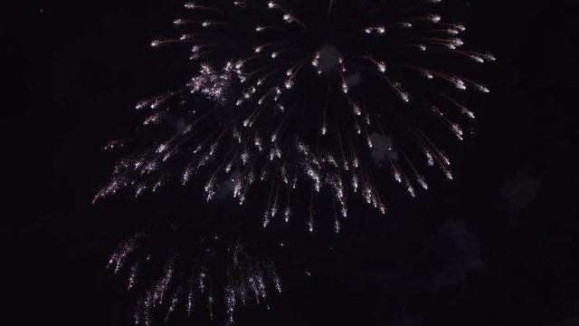 Bright fireworks in night sky after celebration. Holiday