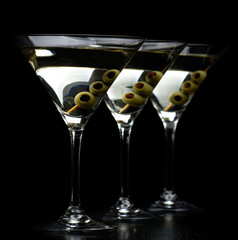Vermouth Martini drinks with olives isolated on black