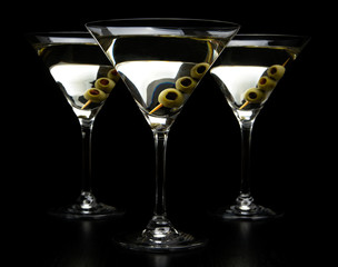 Vermouth Martini drinks with olives isolated on black