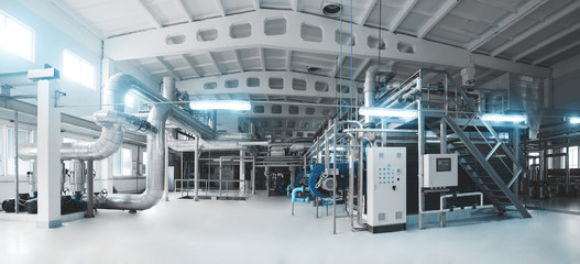 Gas boiler, control cabinet and pipes for the supply of gas and steam. Panoramic view of boiler...