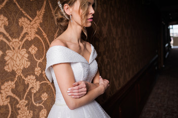 Bride.Young fashion model with perfect skin and make up  brown background  curly hair