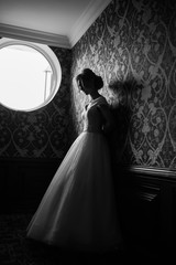 Bride.Young fashion model with perfect skin and make up  brown background  curly hair