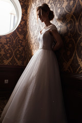 Bride.Young fashion model with perfect skin and make up  brown background  curly hair