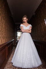 Bride.Young fashion model with perfect skin and make up  brown background  curly hair