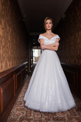 Bride.Young fashion model with perfect skin and make up  brown background  curly hair