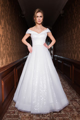 Fototapeta premium Bride.Young fashion model with perfect skin and make up brown background curly hair