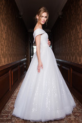 Bride.Young fashion model with perfect skin and make up  brown background  curly hair