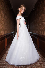 Bride.Young fashion model with perfect skin and make up  brown background  curly hair