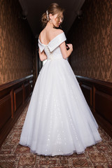 Bride.Young fashion model with perfect skin and make up  brown background  curly hair