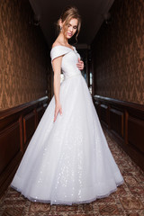 Bride.Young fashion model with perfect skin and make up  brown background  curly hair