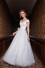 Bride.Young fashion model with perfect skin and make up  brown background  curly hair