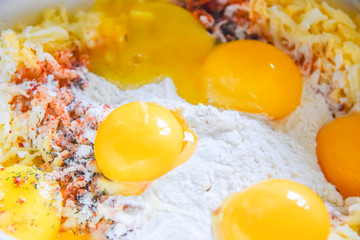 raw yolks lie on white flour cooking spices top view abstraction