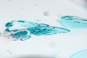 flow of blue paint on a white background abstract bright colored background
