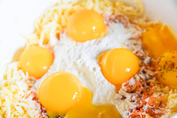 raw yolks lie on white flour cooking spices top view abstraction