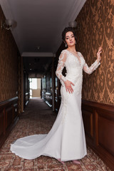 Bride wearing long wedding dress.