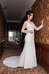 Bride wearing long wedding dress.
