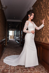 Bride wearing long wedding dress.