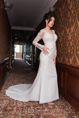 Bride wearing long wedding dress.