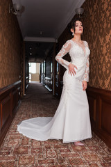 Bride wearing long wedding dress.