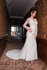 Bride wearing long wedding dress.