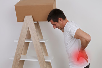 Man suffering from back pain. Muscle spasm, rheumatism. Pain relief, ,chiropractic concept.